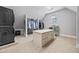 A spacious walk-in closet features built-in shelving, a large island, and a full-sized washer and dryer at 2517 Stone Manor Dr, Buford, GA 30519