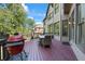 Outdoor deck with space for dining and relaxation, adjacent to the home's exterior at 2517 Stone Manor Dr, Buford, GA 30519