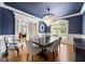 Elegant dining room with hardwood floors, chandelier, and large windows at 2517 Stone Manor Dr, Buford, GA 30519
