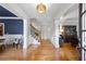 Elegant foyer with hardwood floors, white trim, and stylish decor at 2517 Stone Manor Dr, Buford, GA 30519