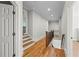 The upper-level hallway features wood floors and staircase overlooking a lower level at 2517 Stone Manor Dr, Buford, GA 30519