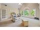 Bright living room with large windows offering great natural light and backyard views at 2517 Stone Manor Dr, Buford, GA 30519