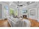 Bright living room with fireplace, built-in shelving, and hardwood floors at 2517 Stone Manor Dr, Buford, GA 30519