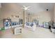 This room features a neutral color scheme, plush carpeting, and built-in shelves ideal for storage and display at 2517 Stone Manor Dr, Buford, GA 30519