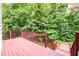 Back deck with railing overlooking a lush green yard at 3648 Clark Hill Way, Buford, GA 30519