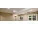 View of the basement with carpeted floors and window overlooking greenery at 3648 Clark Hill Way, Buford, GA 30519