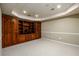 Finished basement featuring custom built-in shelving and cabinetry for storage and media at 3648 Clark Hill Way, Buford, GA 30519