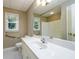 Bathroom with grab bars, a window, and a white sink at 3648 Clark Hill Way, Buford, GA 30519
