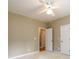 Bedroom featuring neutral walls, ceiling fan, and doorways at 3648 Clark Hill Way, Buford, GA 30519
