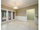 Dining area features tile flooring, neutral colors and natural light from the patio at 3648 Clark Hill Way, Buford, GA 30519