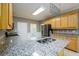 This kitchen offers granite countertops, stainless steel appliances and a large island at 3648 Clark Hill Way, Buford, GA 30519