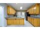 Large kitchen with island, granite countertops, stainless steel appliances and ample cabinets at 3648 Clark Hill Way, Buford, GA 30519