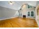 Vaulted living room with fireplace, hardwood floors, and abundant natural light at 3648 Clark Hill Way, Buford, GA 30519