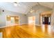 Spacious living room featuring hardwood floors, vaulted ceilings, and an open layout at 3648 Clark Hill Way, Buford, GA 30519