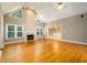 Large living room boasts hardwood floors, a fireplace, and vaulted ceilings at 3648 Clark Hill Way, Buford, GA 30519