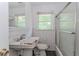 Bathroom featuring an outdated vanity, toilet, and shower at 1167 Sanders Dr, Morrow, GA 30260