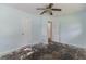 The bedroom features wood floors, two windows, and light blue walls at 1167 Sanders Dr, Morrow, GA 30260