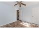 The bedroom features wood floors, two windows, and light blue walls at 1167 Sanders Dr, Morrow, GA 30260