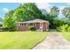 Charming brick home featuring a well-maintained lawn and a classic single-story design at 1167 Sanders Dr, Morrow, GA 30260