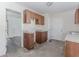 Depicts an outdated kitchen with damaged cabinets and deteriorated surfaces at 1167 Sanders Dr, Morrow, GA 30260