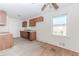Functional kitchen with wood cabinets, ample counter space, and a well-lit window at 1167 Sanders Dr, Morrow, GA 30260