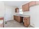 Classic kitchen featuring wood cabinetry, functional layout, and a bright window above the sink at 1167 Sanders Dr, Morrow, GA 30260