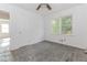 An empty room shows damaged tile flooring and natural light at 1167 Sanders Dr, Morrow, GA 30260