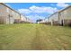 View of large grass backyard for a community of homes at 11689 Mendenhall Ct, Hampton, GA 30228