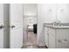 This home features a bathroom with granite counters and ample storage at 11689 Mendenhall Ct, Hampton, GA 30228