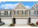 Charming townhome with a one-car garage and well-maintained landscaping at 11689 Mendenhall Ct, Hampton, GA 30228