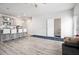 Open floor plan showing kitchen with island bar, stainless steel appliances, and lots of natural light at 11689 Mendenhall Ct, Hampton, GA 30228