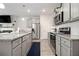 Beautiful kitchen equipped with granite countertops, stainless steel appliances, and wood floors at 11689 Mendenhall Ct, Hampton, GA 30228