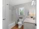 Bathroom featuring shower-tub, and a vanity with framed mirror at 124 Hunters Mill Rd, Woodstock, GA 30188
