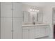 Bright bathroom featuring double vanity with white cabinets and framed mirrors at 124 Hunters Mill Rd, Woodstock, GA 30188