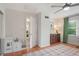 Bright bedroom with a fun play area, dresser, hardwood floors and access to the exterior at 124 Hunters Mill Rd, Woodstock, GA 30188