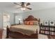 Inviting bedroom with a ceiling fan, a cozy rug, and ample natural light at 124 Hunters Mill Rd, Woodstock, GA 30188