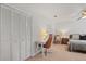 Bedroom featuring closet, ceiling fan, and a cozy desk area at 124 Hunters Mill Rd, Woodstock, GA 30188