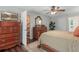 Tranquil bedroom with lots of storage space, access to the bathroom, and staircase at 124 Hunters Mill Rd, Woodstock, GA 30188