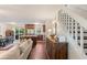 Spacious living area seamlessly connects to the kitchen, creating an inviting open-concept layout with ample seating at 124 Hunters Mill Rd, Woodstock, GA 30188