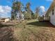 The backyard of this home is level and features mature trees and a wood deck at 1783 Big Valley Ln, Stone Mountain, GA 30083