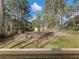 Exterior view of backyard from a new deck overlooking a treed lot at 1783 Big Valley Ln, Stone Mountain, GA 30083