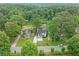 Aerial view of the home and surrounding landscape with trees and lawns at 2822 Waters Sw Rd, Atlanta, GA 30354