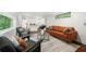 Cozy basement featuring a leather sofa, accent chairs, and a stylish rug at 2822 Waters Sw Rd, Atlanta, GA 30354