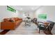 Finished basement with a comfortable leather sofa, modern chairs, and ample natural light at 2822 Waters Sw Rd, Atlanta, GA 30354