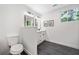 Modern bathroom features a vanity with stone floors and ample light at 2822 Waters Sw Rd, Atlanta, GA 30354