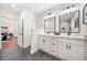 Luxurious bathroom with double vanity and tiled floors, located off the main bedroom at 2822 Waters Sw Rd, Atlanta, GA 30354