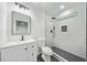 Modern bathroom with sleek tiled shower, new fixtures and modern vanity at 2822 Waters Sw Rd, Atlanta, GA 30354
