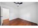 Minimalist bedroom with hardwood floors and a view to an adjacent space at 2822 Waters Sw Rd, Atlanta, GA 30354