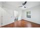 Well-lit bedroom with hardwood floors and a modern ceiling fan, leading to a stylish bathroom at 2822 Waters Sw Rd, Atlanta, GA 30354