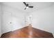 Empty bedroom with hardwood floors, white walls, and two entry doors at 2822 Waters Sw Rd, Atlanta, GA 30354